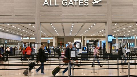 Passenger are heading to the security checkpoint at the Kansas City International Airport the Monday before Thanksgiving.