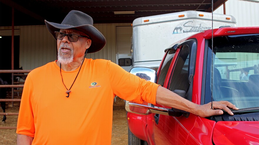 Willie Johnson stands outside the paddocks at the Pontotoc County Agric-Center in Pontotoc, Mississippi, on June 19, 2024. Johnson attended the Juneteenth Horse Show to support his nephew, Jaden Montgomery.