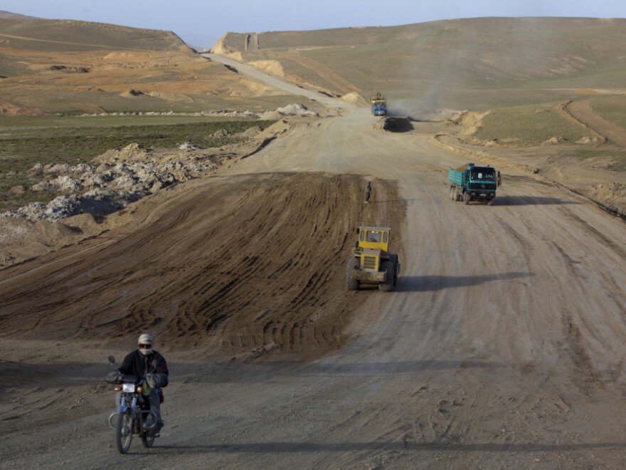 A motorcyclist rides along the still under construction Bamiyan-Yakawlang road in Yakawlang, Afghanistan, June 10. Despite the construction of new roads, many of them are unsafe to drive.