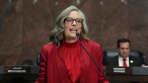 Arizona Democratic Gov. Katie Hobbs gives her State of the State address in the House of Representatives at the Capitol with Senate President Warren Petersen, R-Gilbert, seated right, Monday, Jan. 12, 2026, in Phoenix.