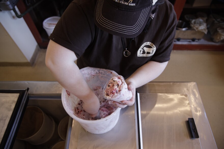 Scooping a Cranberry Jubilee sundae at The Ice Cream Barn
