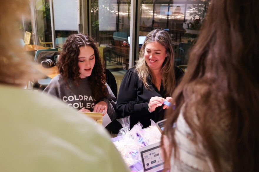 Isabella Good, right, and Emily Cabral check participants in for Sex Ed Trivia Night Thursday, Feb. 8, 2024, at Hello Dumpling in Dallas. The event benefits Wholly Informed Sex Ed, a nonprofit that advocates for comprehensive, medically accurate sex education for youth.