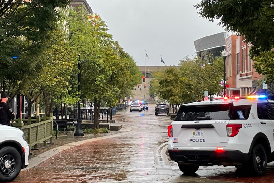 Evansville Police vehicles parked on Main St. investigating an apparent false report of a threat to Signature School, Oct. 2, 2026