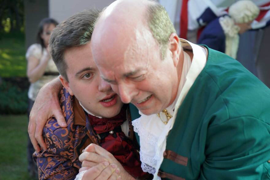 Jackson Hooper and Todd Nelson perform during an immersive theatrical murder mystery at the Soldotna Public Library in Soldotna, Alaska, on Wednesday, July 29, 2026.