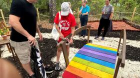 The Community Rainbow Bridge Memorial unveiled on Saturday next to Trinity Metropolitan Community Church. (Sanjeev Palasseri/WUFT News)