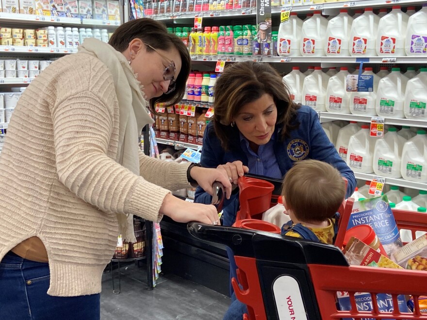 Gov. Kathy Hochul meets with Cheektowaga’s Mandy Brenisier and Mandy’s 10-month-old baby daughter while visiting a Tops Friendly Market on Union Road Friday afternoon.