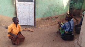 You've got to get down — literally — when greeting someone in Northern Ghana.