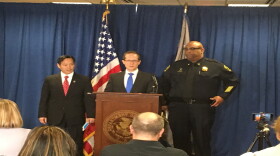 IRS Acting Special Agent in Charge William Cheung (left), and Police Chief Eliot Isaac (right), join US Attorney Ben Glassman Friday afternoon to announce charges.