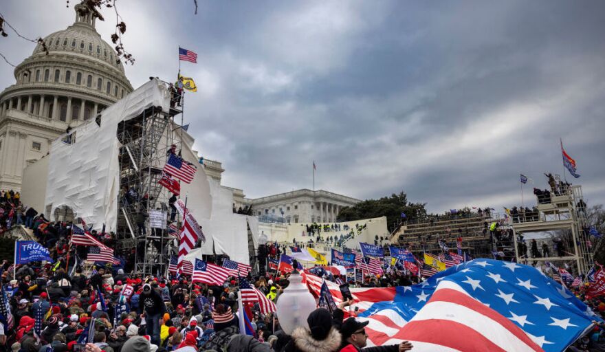 Rioters storm the Capitol on Jan. 6. Among those charged in connection with the insurrection are members of the paramilitary group the Oath Keepers.