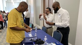 JEA representatives meet with a man attending the JSEB Procurement Summit this week.