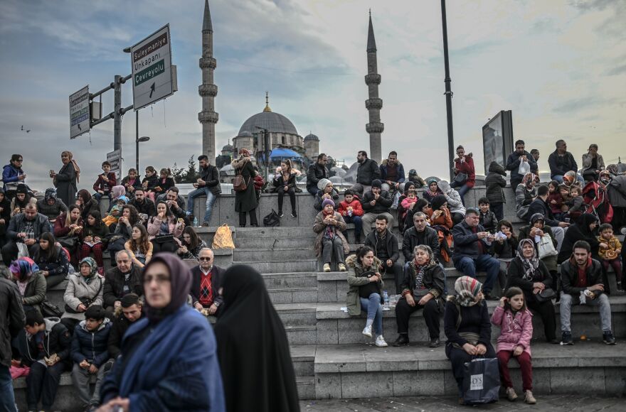 People enjoy a sunny afternoon at Eminonu Square in Istanbul on Jan. 29, 2019.