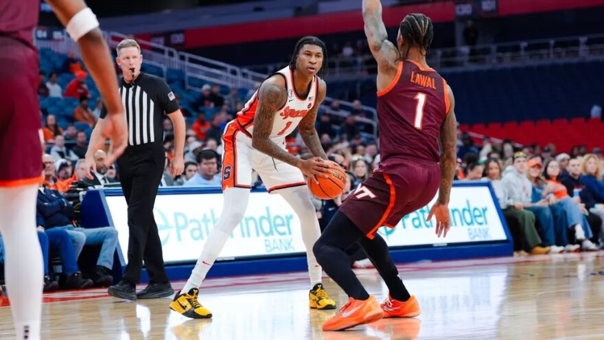 Orange forward Donnie Freeman (1, White) looks to attack the rim against Virginia Tech on Wednesday.
