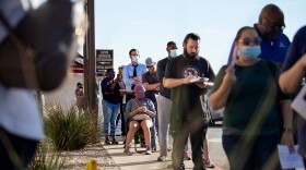 People wait in line to vote in Texas's Tarrant County in October 2020. Voters in the state's 6th Congressional District are casting ballots in a special election that concludes Saturday.
