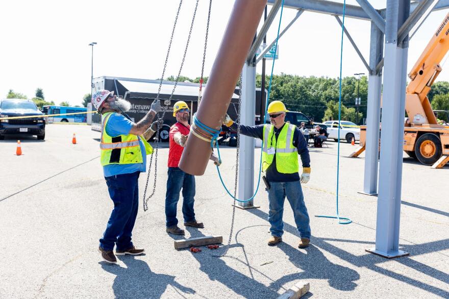 Skilled tradesmen with the United Association of Journeymen and Apprentices of the Plumbing and Pipe Fitting Industry of the United States and Canada train on the Washtenaw Community College campus.