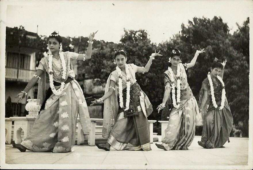 The author's mother, Reba Roy (far left), dancing on stage in a sari as a young woman.