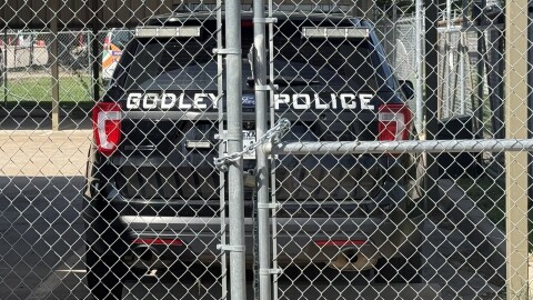 The former police chief of Godley is accused of sexual assault, stalking and collaborating with a local couple to compile information on people they saw as adversaries.