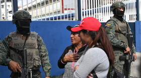 Women seek information about the expected arrival of their relatives who were aboard the Maria Candelaria, a vessel intercepted two days prior by U.S. authorities on suspicion of alleged drug trafficking, at the port in Manta, Ecuador, Monday, Sept. 7, 2026.