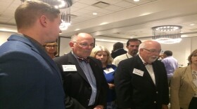 State Board of Elections Chairman Bob Cordle, center, and board member David Black, right, watch a presentation by one of the vendors seeking certification for use in North Carolina elections.