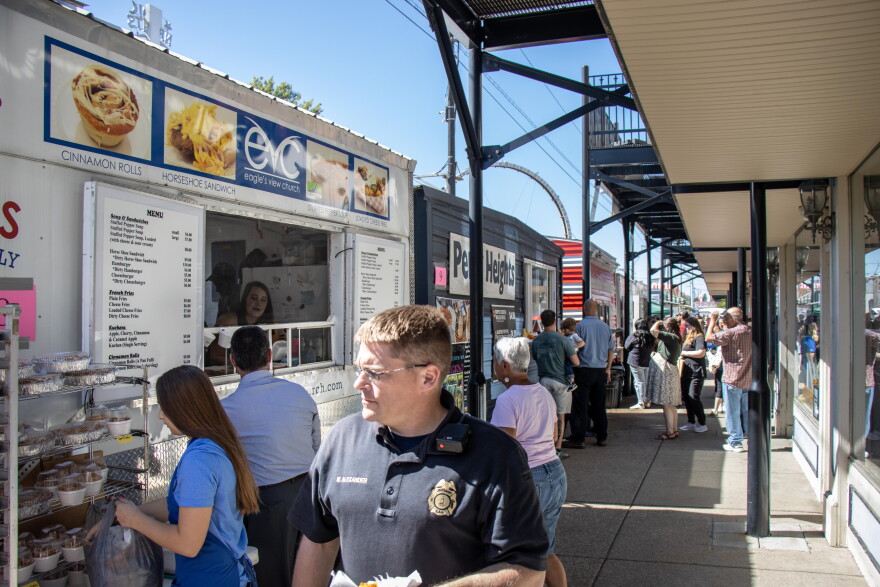 Fall Festival attendees order food from booths on Tuesday of the festival. Non-profits earn money form their booths, and the Nut Club fundraises significantly from the half-pot raffle.