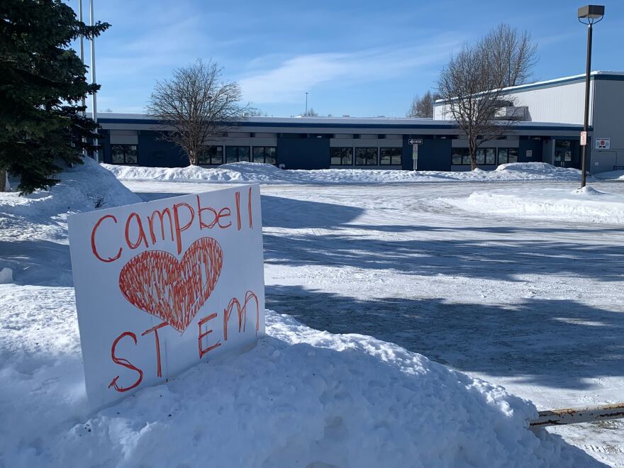 A handmade sign in support of Campbell STEM Elementary School in front of the school's building on March 13, 2026.