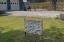 A handwritten yard sign questioning the "secrecy" around a proposed hyperscale data center next door sits in a front yard on Greens Bottom Road in Carroll County.