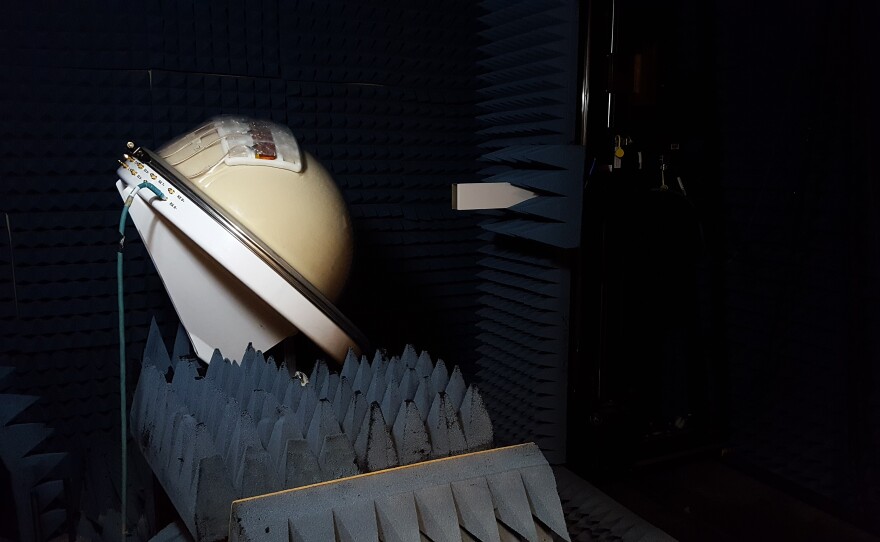 Chris Merola tests the multi-beam prototype in a dark, anechoic chamber at UMass Amherst.
