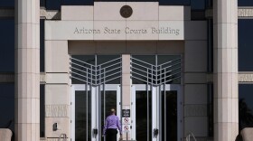 A man enters the Arizona Supreme Court building, Wednesday, April 10, 2024, in Phoenix.