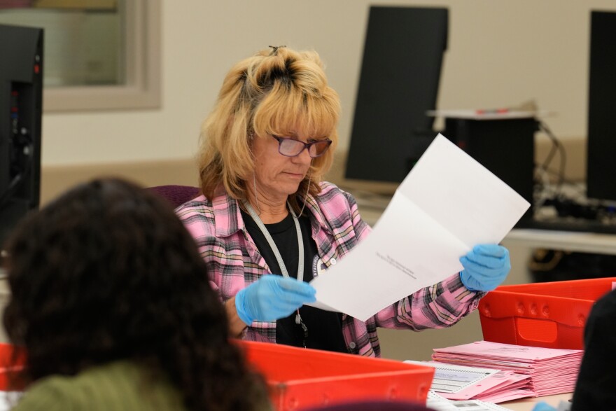 A ballot is inspected at a ballot processing center during the California primary election on Tuesday, June 2, 2026, in Sacramento, Calif.