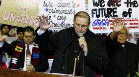 Led by Cardinal Roger Mahony of the Archdiocese of Los Angeles, supporters of the federal DREAM Act participate in a candlelight procession and vigil Tuesday in downtown Los Angeles.