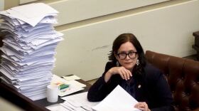 Senate Minority Leader Julia Kirt, D-Oklahoma City, has bills stacked high on her desk in the Senate chamber, a tradition on the final day of the legislative session, on May 14, 2026, at the state Capitol in Oklahoma City. (