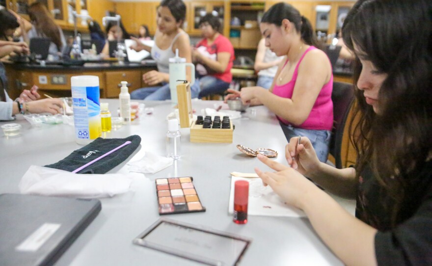 Students experiment with creating their own lip glosses.