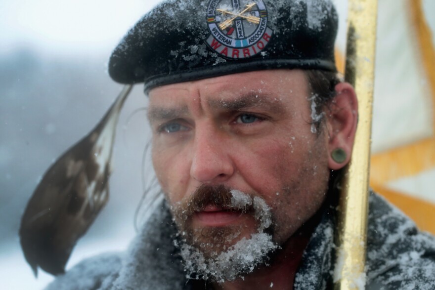 Despite blizzard conditions, Martan Mendenhall, an Army veteran and Blackfoot Indian, joined other military veterans in a march to support the "water protectors" at Oceti Sakowin Camp on Monday.