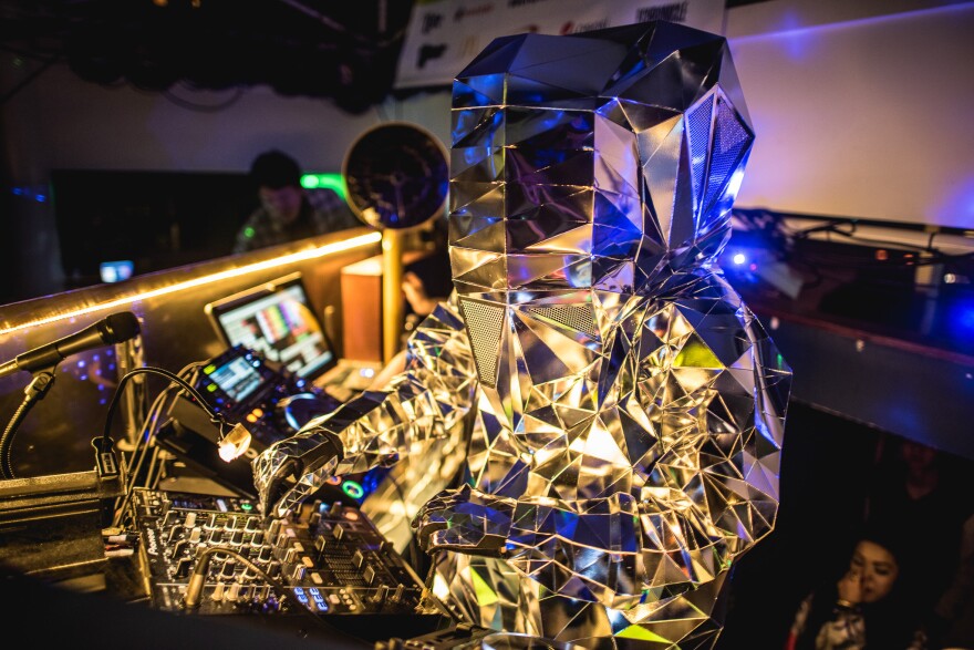 The Korean DJ and producer Hitchhiker plays (in an amazing reflective suit) at Highland.