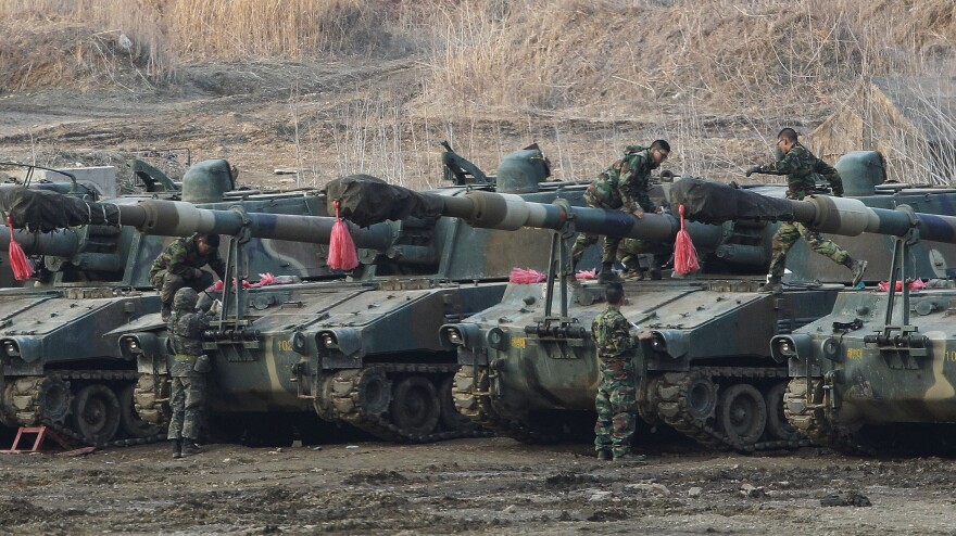 South Korean marines work on their K-55 self-propelled howitzers during an exercise against possible attacks by North Korea near the border village of Panmunjom in Paju, South Korea, Wednesday.