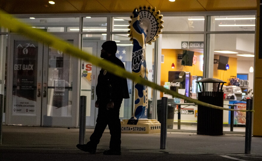 An officer stands guard at an entrance to the Stryker Sports Complex on Saturday evening, following an incident where a vehicle drove onto a field.