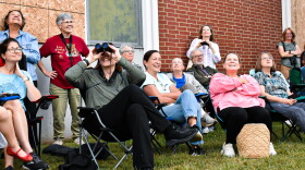 Charlotte locals gather to watch chimney swifts swarm into the abandoned chimney on Tyvola Road.