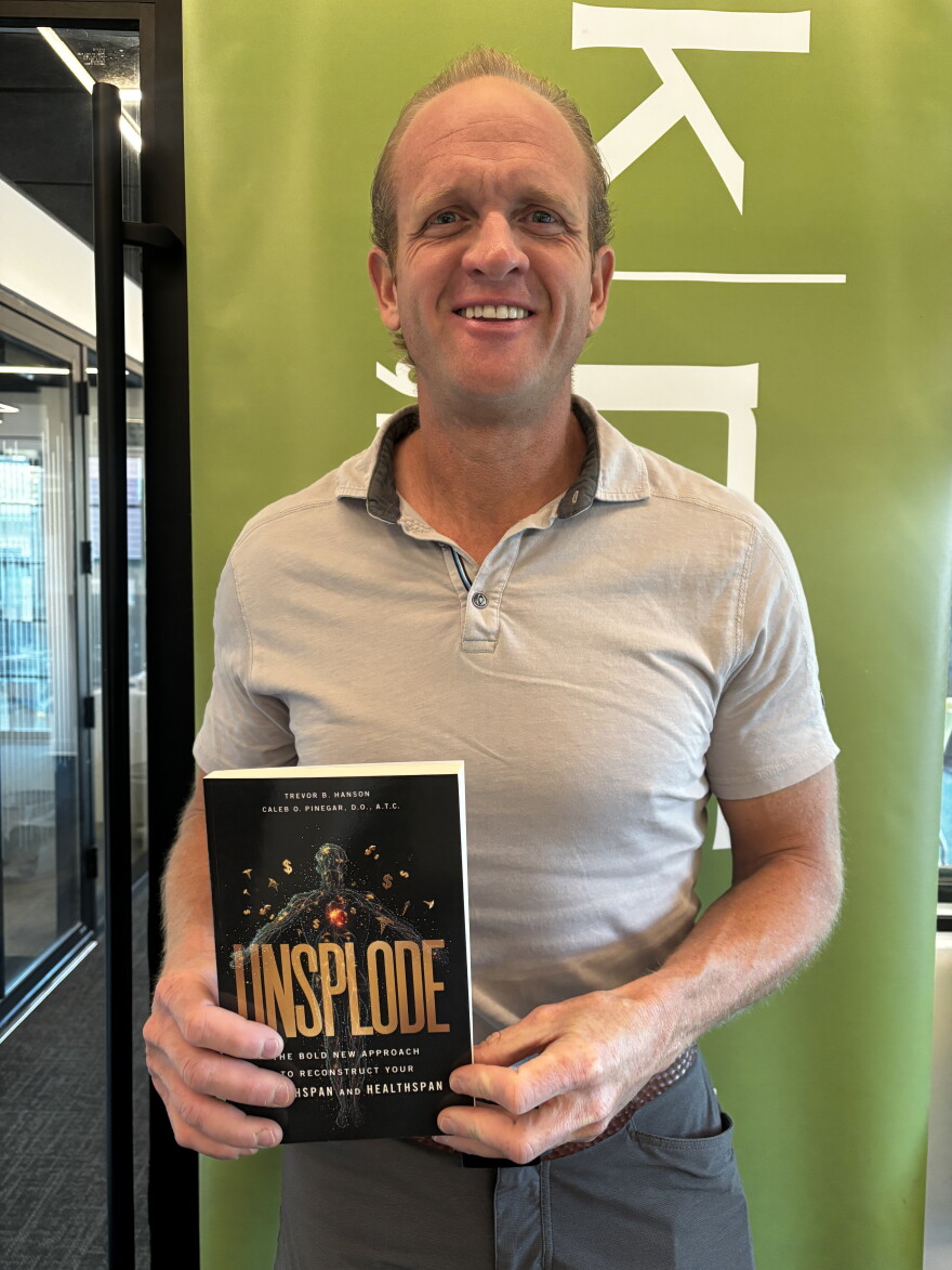 Trevor Hanson with his book "Unsplode"