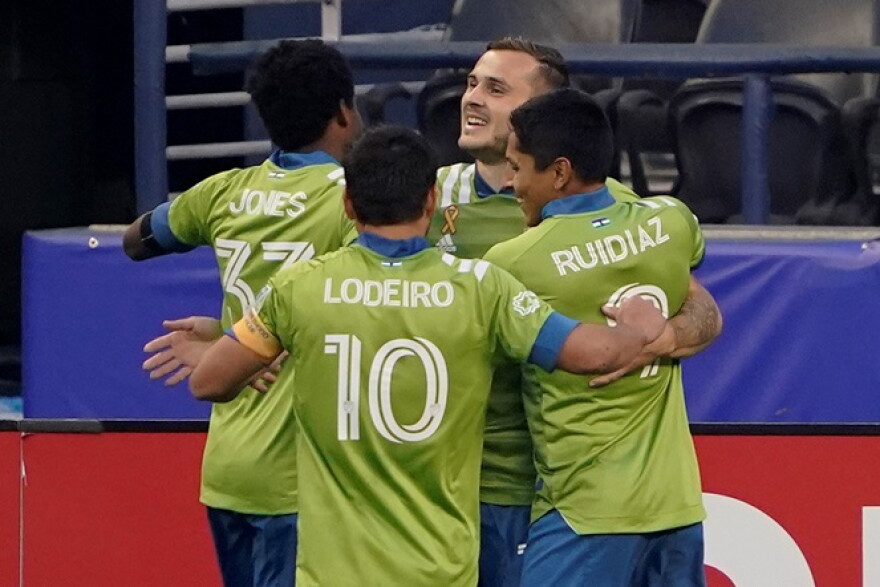 The Sounders' Jordan Morris, back right, celebrates with teammates after he scored his first goal against the San Jose Earthquakes, Thursday, Sept. 10, 2020, in Seattle. 