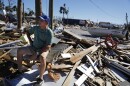 Oct. 12, 2018 - Hector Morales sits on a debris pile near his home in Mexico Beach, FL, which was destroyed by Hurricane Michael.