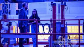 WSU Nuclear Science Center director Corey Hines, left, in the blue glow of the center's nuclear reactor.