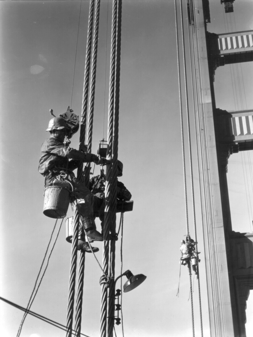 A painter at work in 1937, the year the Golden Gate Bridge opened. It was the longest suspension bridge in the world at the time; painters had to cover more than 10 million square feet of steel.
