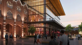 An exterior, street-level rendering of the arena proposed to be constructed along Interstate 35 between Rock Creek Road and Corporate Center Drive in north Norman.