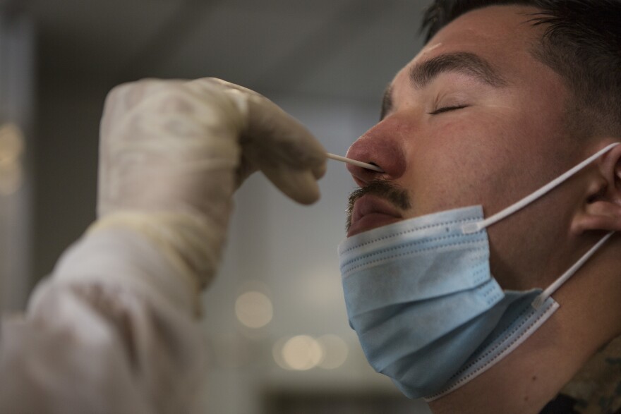 U.S. Marine Corps Cpl. Robert Guerra, a meteorologist with Task Force Koa Moana (TF KM) 20, I Marine Expeditionary Force (I MEF), is tested for COVID-19 at the port of Malakal, Republic of Palau, July 22, 2020. Marines and Sailors with TF KM20, I MEF, are conducting engagements in the Republic of Palau from July through September 2020. Koa Moana, meaning “ocean warrior,” is designed to strengthen and enhance relationships between the U.S. and partner nations/states in the Indo-Pacific region, improve interoperability with local security establishments, and serve as a Humanitarian Assistance Survey Team afloat in support of U.S. Indo-Pacific Command’s strategic and operational objectives. TF KM20 provides a unique opportunity to enhance relationships in the Republic of Palau. The Koa Moana task force has taken extensive measures to mitigate the spread of COVID-19. The health and safety of U.S. service members and Palauan citizens participating in TF KM20 is an enduring priority. Prior to deploying, all exercise members participated in a three-week quarantine. After arriving in Palau, the Marines and Sailors remain quarantined for an additional 14 days. To date, all members deployed as part of TF KM20 tested negative for COVID-19. (U.S. Marine Corps photo by Cpl. Anabel Abreu Rodriguez)