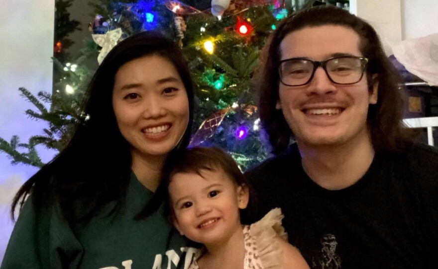 Bethany Long Newman and her husband, Christian Newman, and daughter Vivienne, 3.