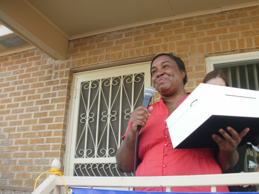 Molly Butler thanks St. Bernard Project volunteers for rebuilding the home she lost after Hurricane Katrina.