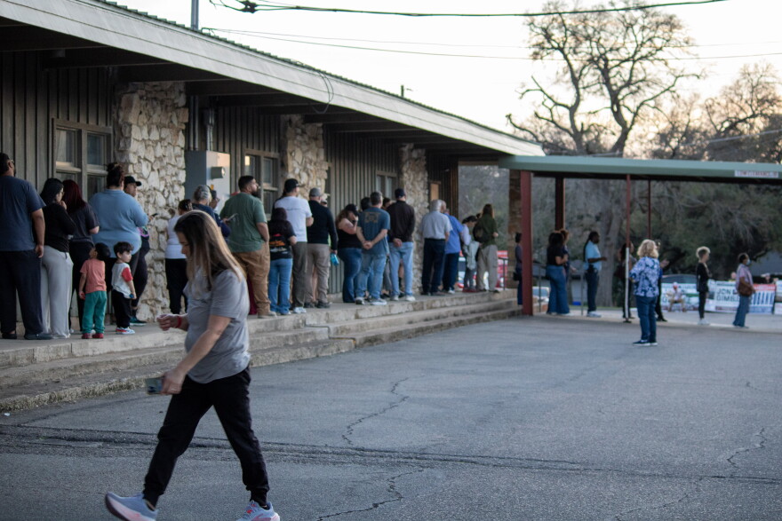 Voters wait in line during early voting for the March 2026 primary elections.