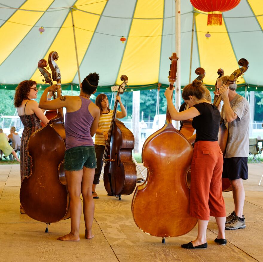 Students take a workshop in upright bass at a previous Culture Camp.