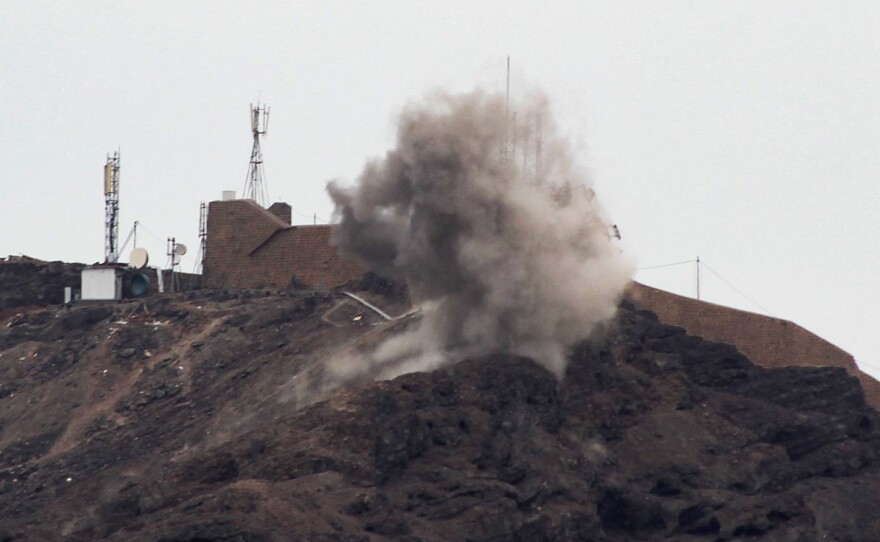 Smoke billows from a hilltop during clashes Sunday between southern separatists and forces loyal to the Saudi-backed Yemeni president in Aden.