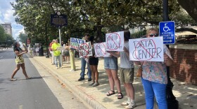 Protesters hold signs opposing Rural Hall data center