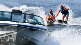 Lisa Casey of Carbondale waterskis for the first time with the help of Jim Kovoleski during Individual Abilities in Motion's Adaptive Water Skiing event.
